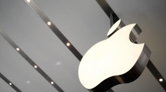 Apple logo is pictured inside the newly opened Omotesando Apple store at a shopping district in Tokyo